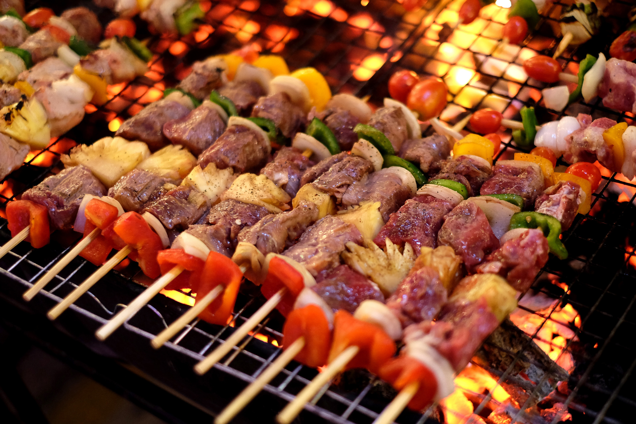 Kebabs grilling over open flames